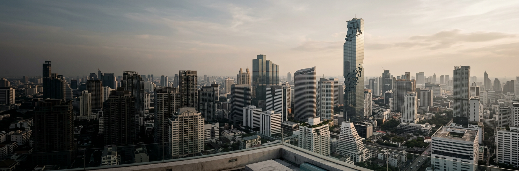 Sunlit towers across Bangkok, home to Jinku business services